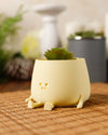 Small Yellow Happy Plant Pot by Ingadi and Albert & Moo